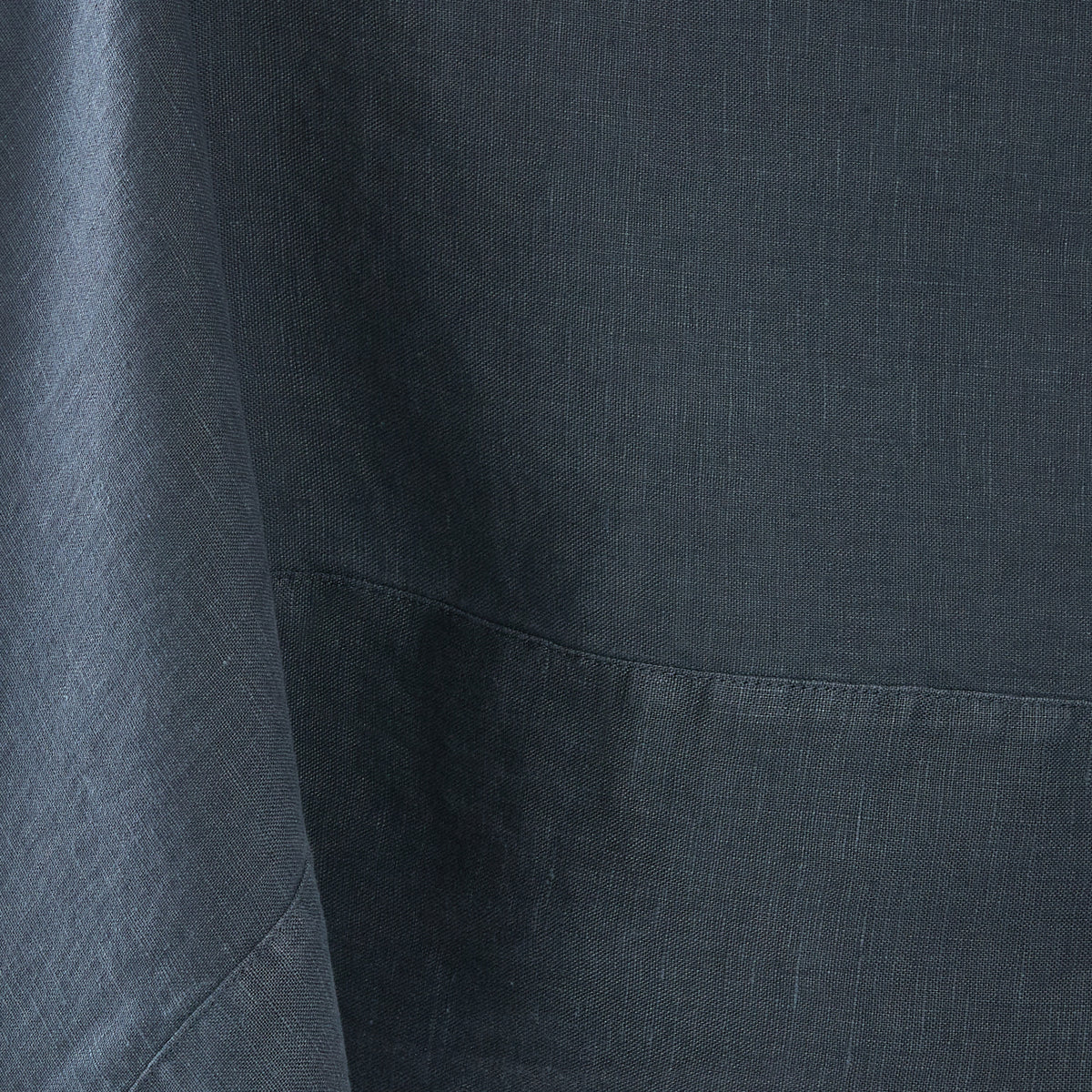 Graphite hand-dyed 100% linen tablecloth with a detailed mitered border and soft, textured fabric finish.