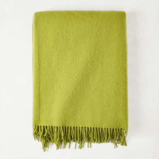 Grass green cashmere throw blanket with classic fringe.