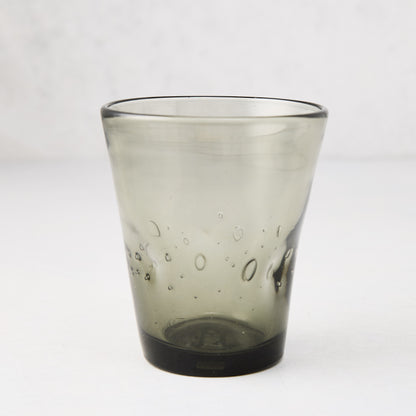 Handmade grey Henri glass, 8 oz, with unique air bubbles and slight asymmetry.