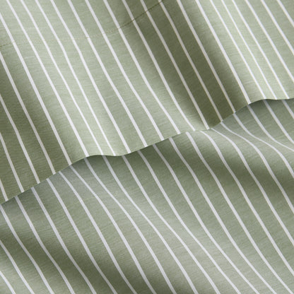 Green and white striped cotton percale sheet set with a crisp, yarn-dyed finish and sewed trim detail.