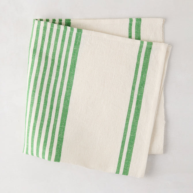 Folded green boat stripe napkin, 22" square, cotton-linen blend.