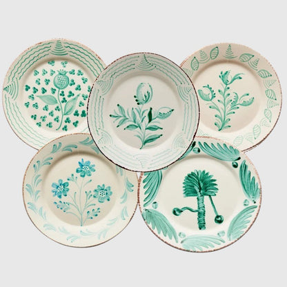 Hudson Grace Casa Nuno ceramic dinner plates featuring hand-painted green botanical designs on cream backgrounds.