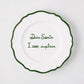 7-inch white ceramic appetizer plate with green hand-painted text reading Dear Santa I can explain and a scalloped green rim.