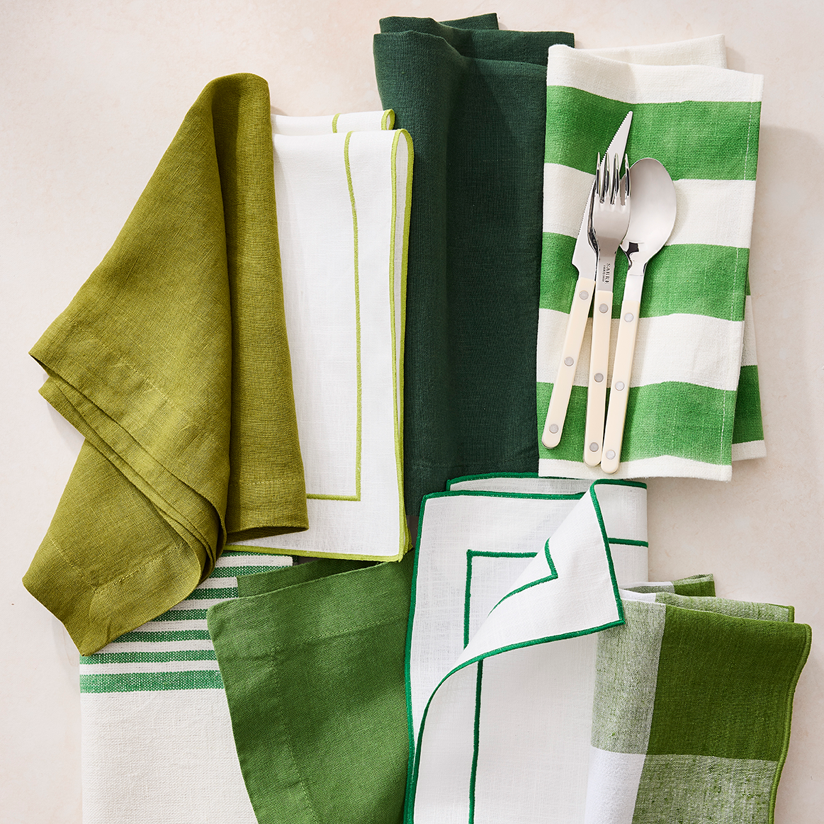 Green Hampton Cotton Stripe Napkin, 22" square, with bold green and white stripes.