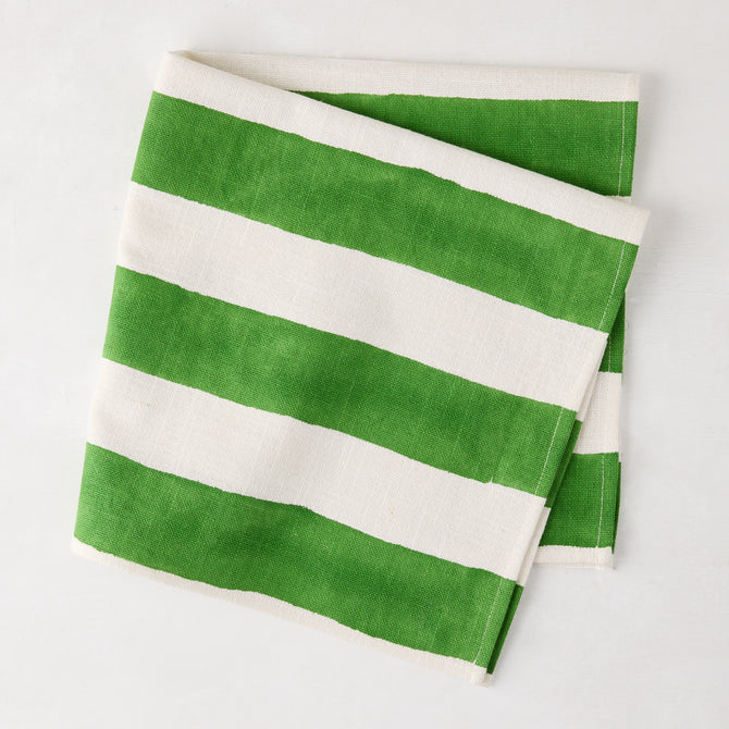 Folded Green Hampton Cotton Stripe Napkin, 22" square, with bold green and white stripes.