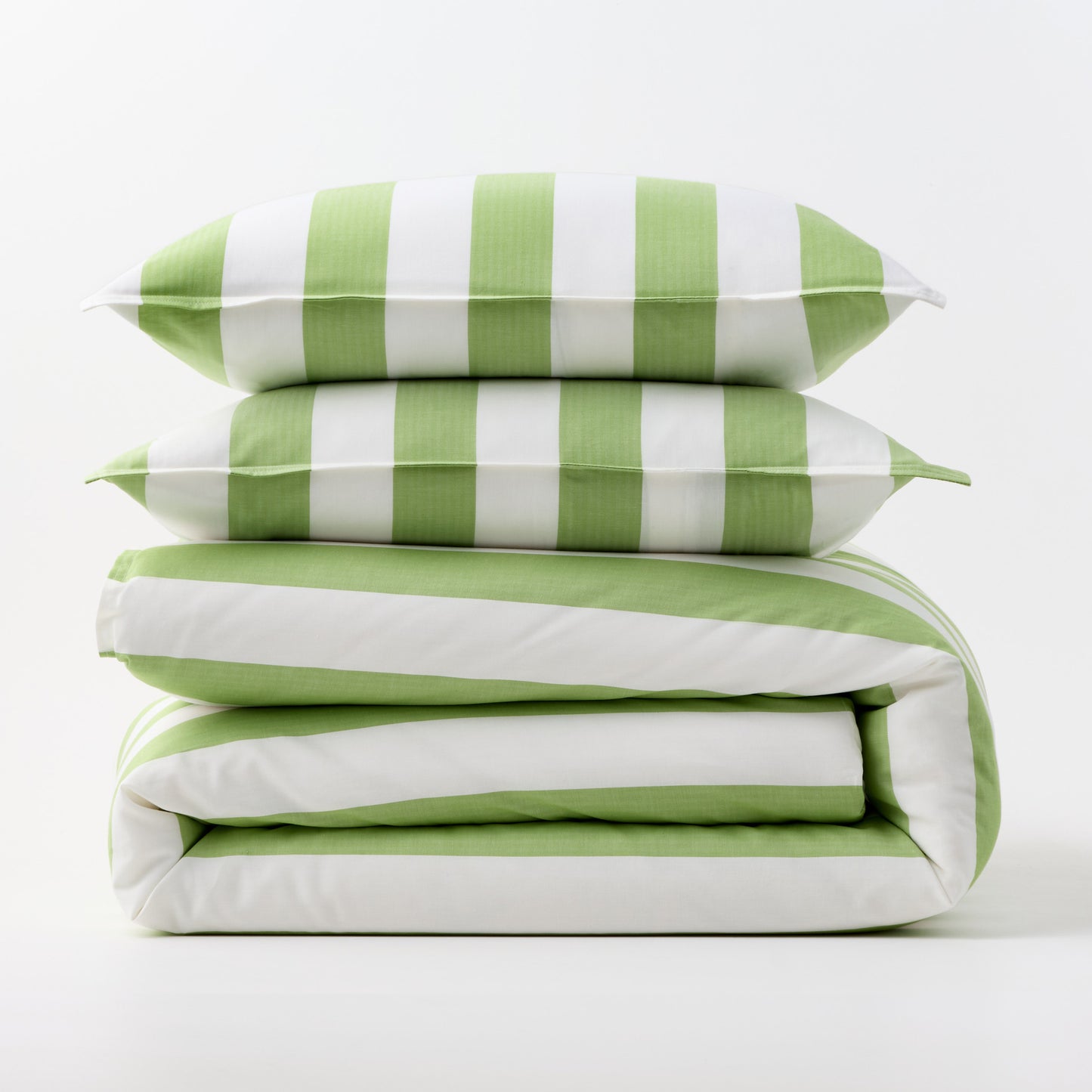 Green and white wide-striped duvet cover and two matching pillow shams stacked on a white background.