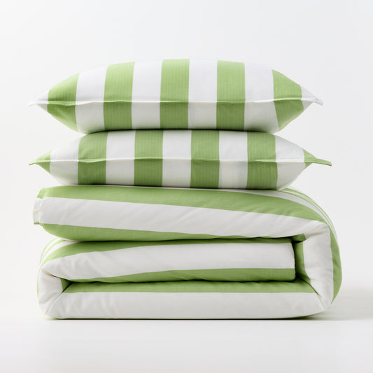 Green and white wide-striped duvet cover and two matching pillow shams stacked on a white background.