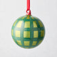 Hudson Grace 3"Dia mouth-blown glass bauble ornament with green jolly gingham pattern and red ribbon.