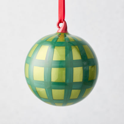 Hudson Grace 3"Dia mouth-blown glass bauble ornament with green jolly gingham pattern and red ribbon.