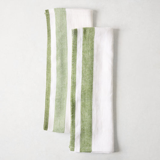 Set of two 30x20-inch white linen hand towels featuring green herringbone stripe borders.