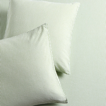 Set of 2 green seersucker stripe organic cotton Euro shams with envelope closures.