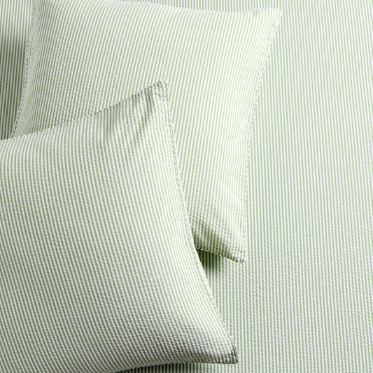Set of 2 green seersucker stripe organic cotton Euro shams with envelope closures.