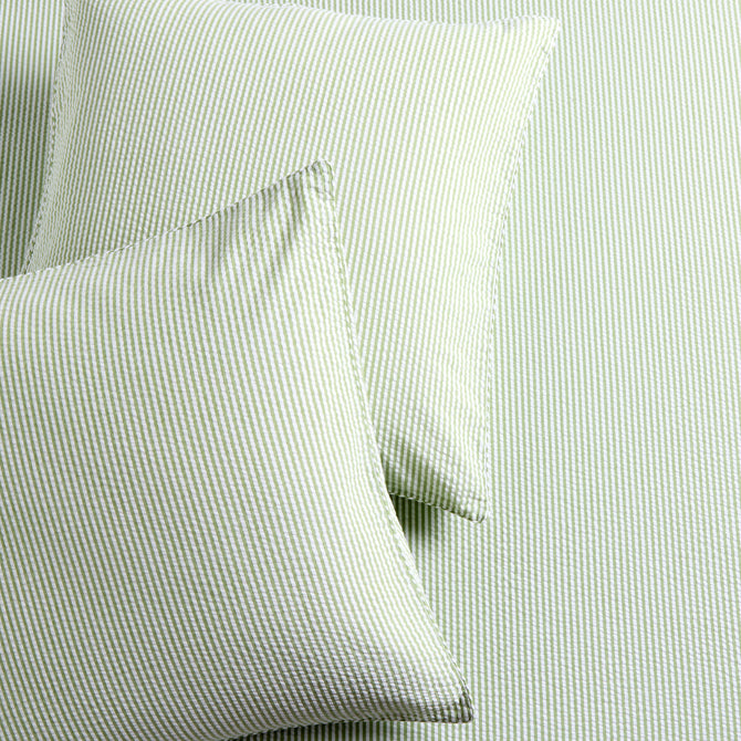 Set of 2 green seersucker stripe organic cotton Euro shams with envelope closures.