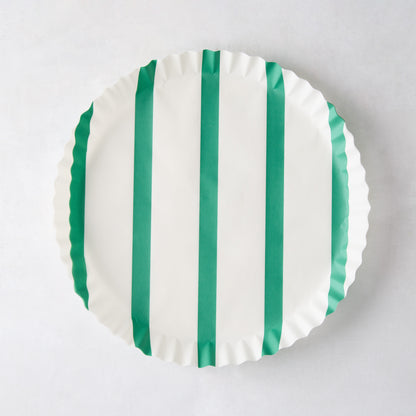White round parchment liner with green vertical stripes and ruffled edges.