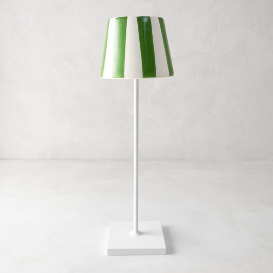 Green and white striped ceramic lamp shade on a white Poldina Pro lamp.
