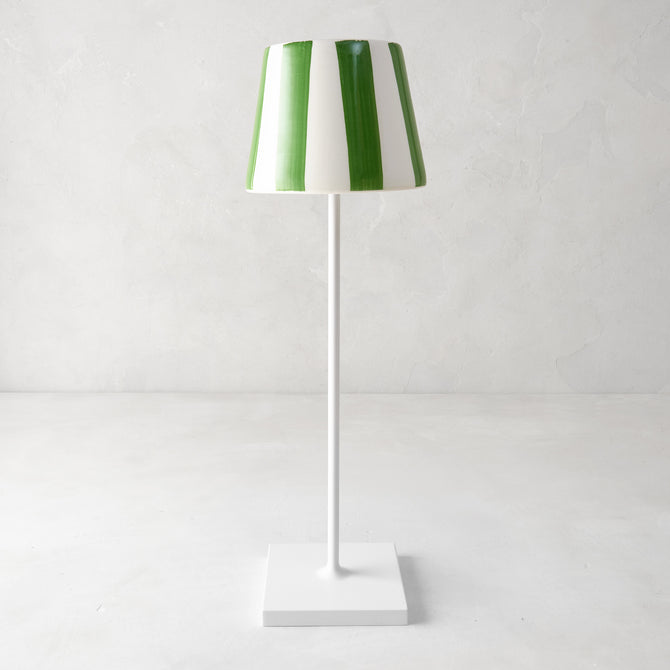 Green and white striped ceramic lamp shade on a white Poldina Pro lamp.
