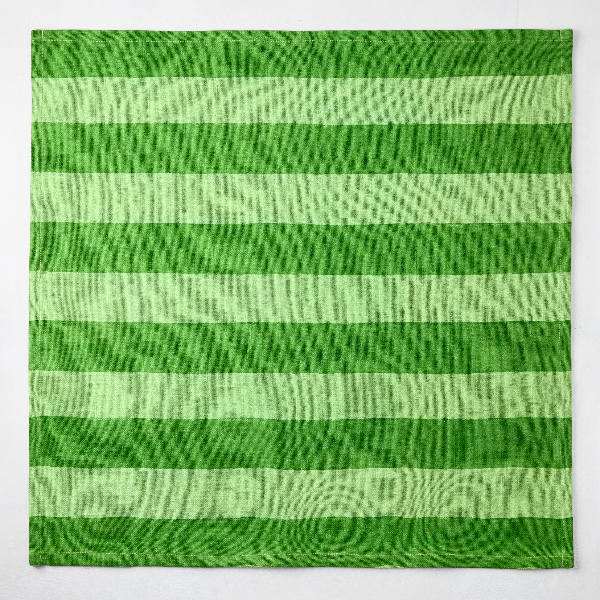 Green Tonal Hampton Stripe Cotton Napkin, 22" square, with bold two-toned green horizontal stripes.
