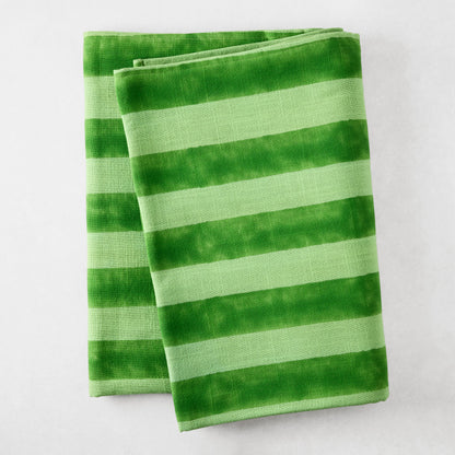 Folded Green Tonal Hampton Stripe Cotton Tablecloth with bold, two-toned green stripes.