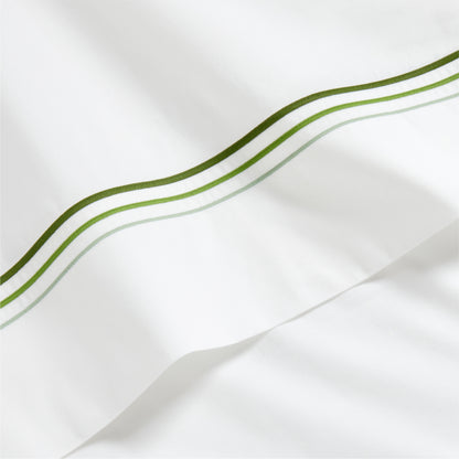 White percale sheet with a green triple-stitch border.