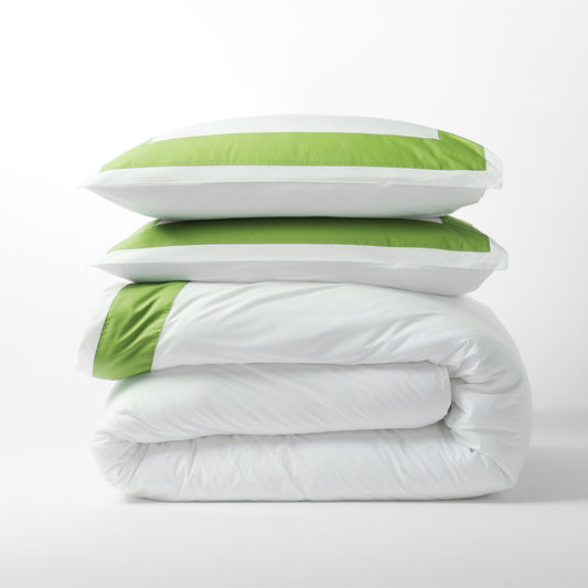Green Wide-Band Percale Duvet Cover and two shams, folded and stacked.