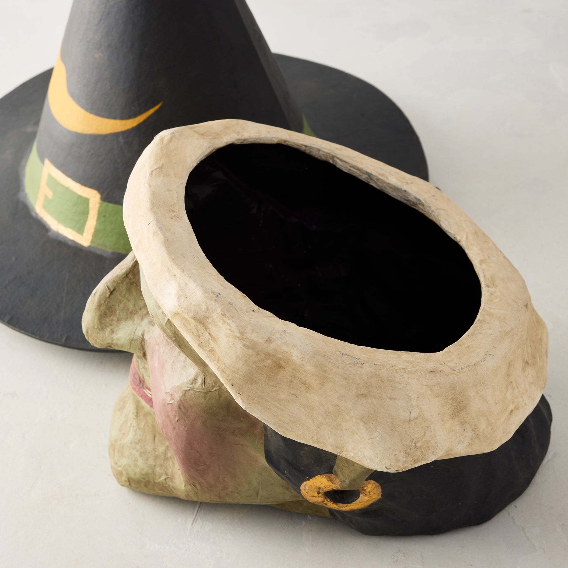 Vintage-style green witch papier-mâché candy bucket with a removable black witch hat lid, 13 inches tall.