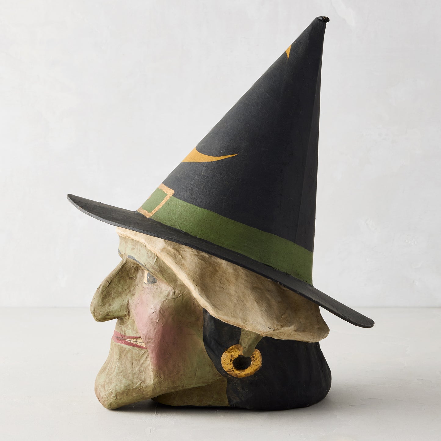 Vintage-style green witch papier-mâché Halloween candy bucket with a tall black hat, 13 inches tall.