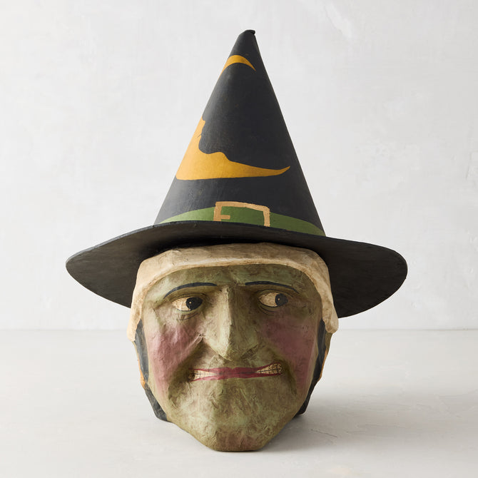 Distressed green papier-mâché witch candy bucket with a black pointed hat, 13 inches tall, vintage Halloween style.