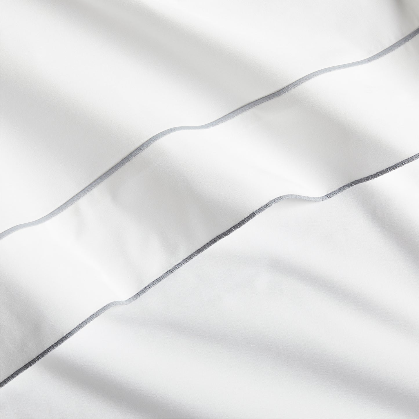 White percale sheet with a grey satin stitch border.