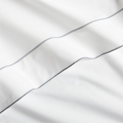 White percale sheet with a grey satin stitch border.