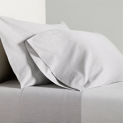 Grey Stripe Cotton-Chambray Sheet Set with thin woven stripes and two pillowcases.