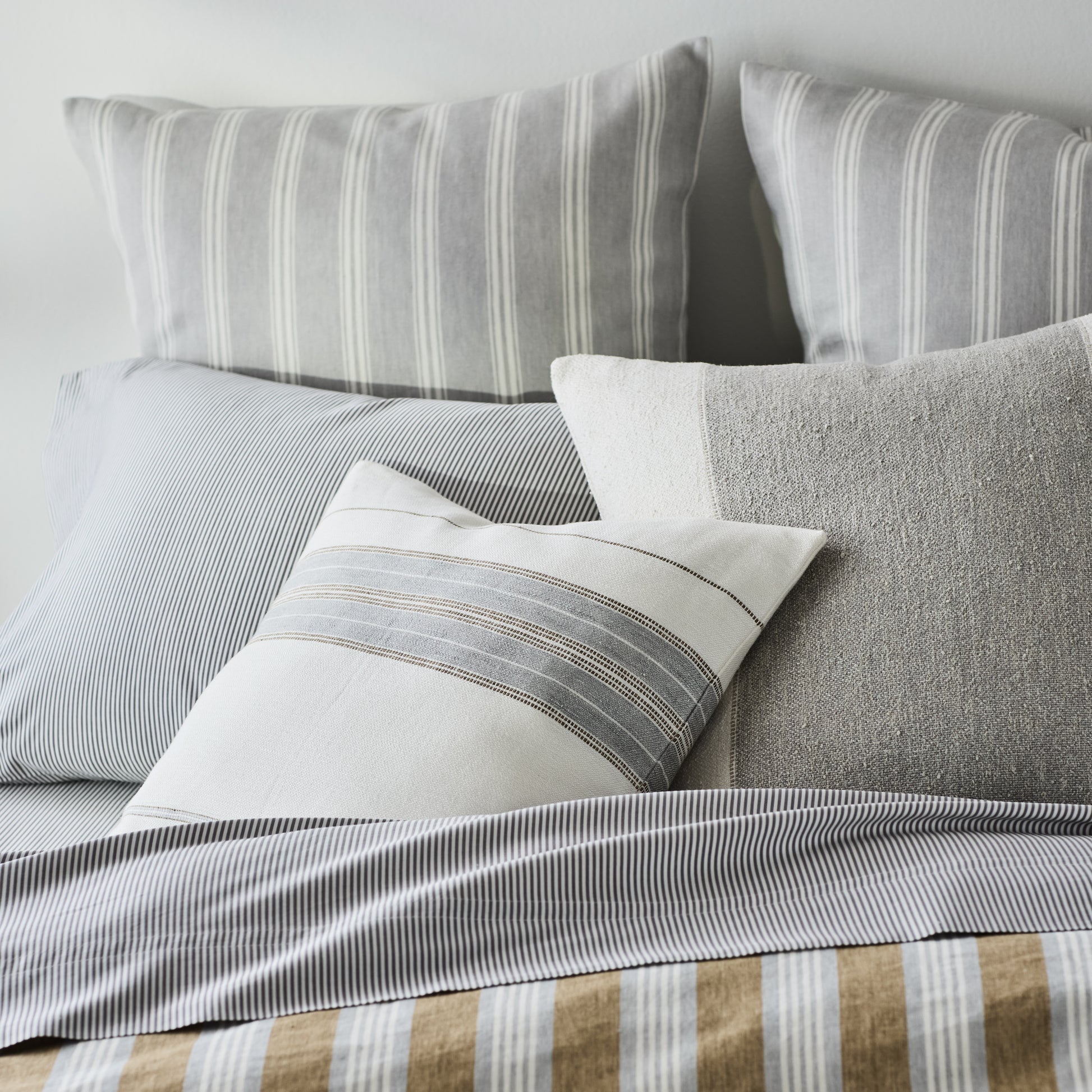 Guest House Stripe Linen Pillow Sham in oyster and light grey stripes, made of Belgian flax linen.
