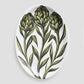 Oval ceramic serve platter with hand-painted green artichoke design on a white glazed background, 15.75 by 11.8 inches.