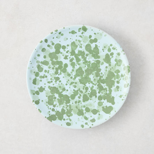 Hand-painted Italian stoneware appetizer plate, 6.3"Dia, with pale blue glaze and green splatter pattern.