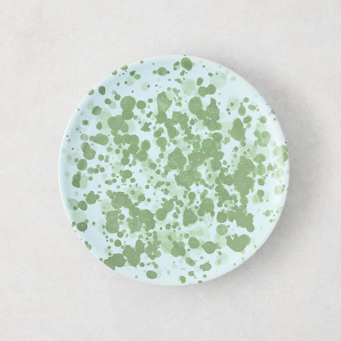 Hand-painted Italian stoneware appetizer plate, 6.3"Dia, with pale blue glaze and green splatter pattern.