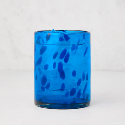 Handmade 12oz blue tortoise double old-fashioned glass, mouth-blown with unique dark blue speckles.