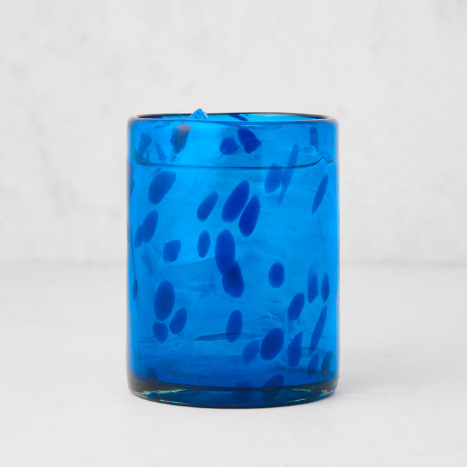 Handmade 12oz blue tortoise double old-fashioned glass, mouth-blown with unique dark blue speckles.