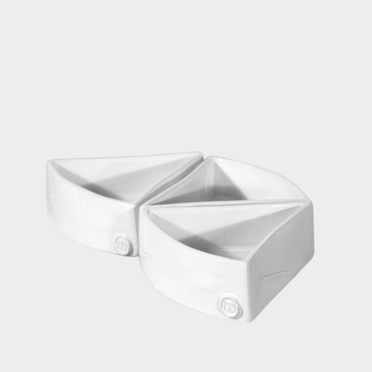 Two creamy white, organic-shaped ceramic appetizer bowls by Montes Doggett, 5"L x 5"W x 1.75"H.