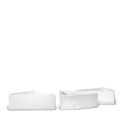 Three creamy white, organic-shaped ceramic appetizer bowls by Montes Doggett.