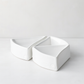 Two creamy white, handmade Peruvian ceramic appetizer bowls, organic-shaped, 5"L x 5"W x 1.75"H.