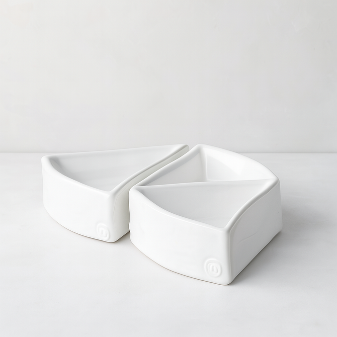 Two creamy white, handmade Peruvian ceramic appetizer bowls, organic-shaped, 5"L x 5"W x 1.75"H.