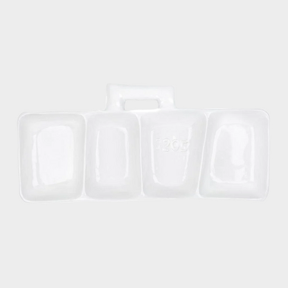 Handmade Montes Doggett creamy white ceramic appetizer platform with four sections and a handle, engraved with "1205".