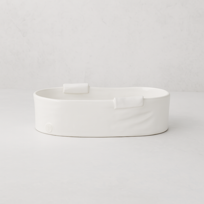 Handmade Montes Doggett small ceramic baker 4696, creamy white, organic shape, with two small handles.