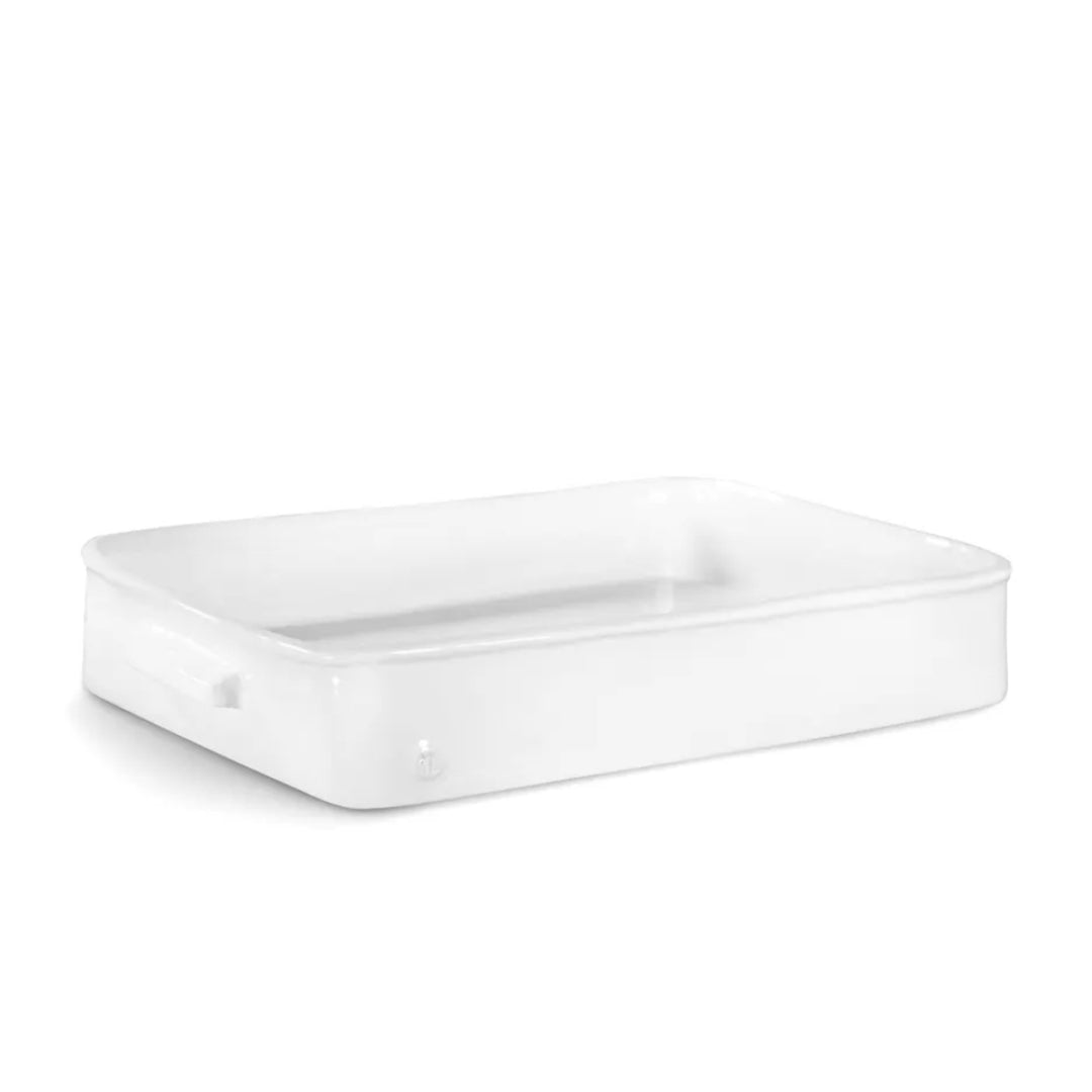 White rectangular ceramic baker by Montes Doggett, 15"L x 10"W x 3"H, with small handle.