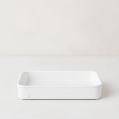 Montes Doggett large rectangular white ceramic baker with 3-inch high edges.