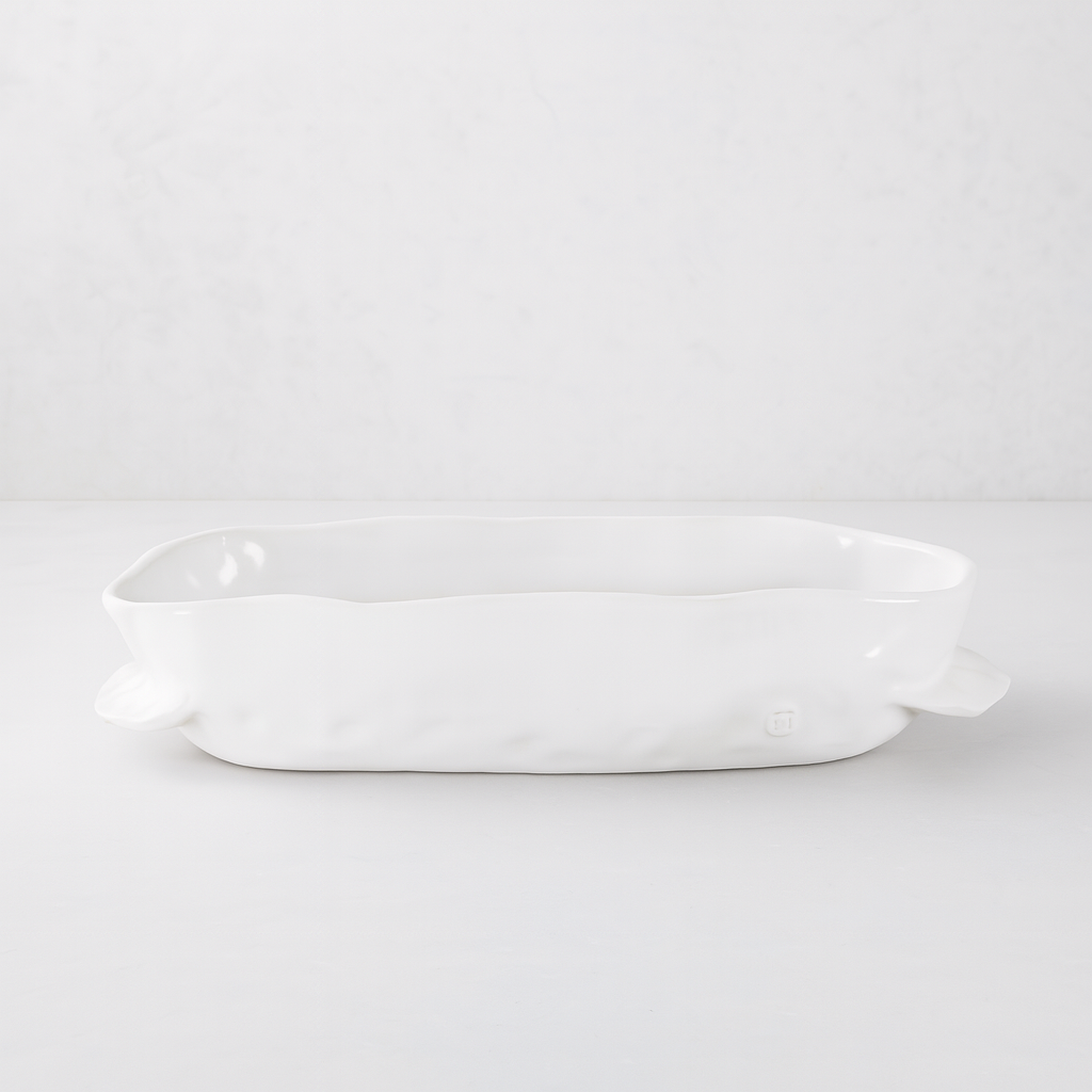 Handmade creamy white ceramic baker 5208 by Montes Doggett, organic shape, 12"L x 8"W x 3"H.