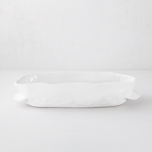 Handmade creamy white ceramic baker 5208 by Montes Doggett, organic shape, 12"L x 8"W x 3"H.