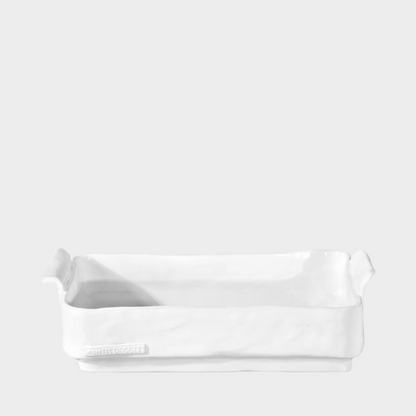 Handmade creamy white ceramic baker by Montes Doggett, organic shape, 12.75"L x 7.5"W.