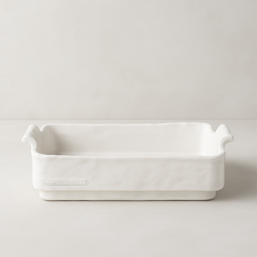 Handmade creamy white ceramic baker by Montes Doggett, organic shape with handles.