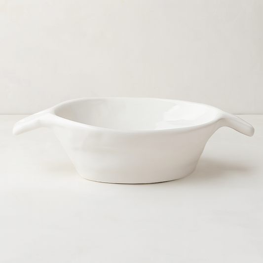 Handmade Montes Doggett ceramic bowl, creamy white glaze, 8.5"Dia x 2.75"H, with small handles.