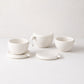Montes Doggett set of 3 handmade white ceramic bowls with lids/coasters and handles.